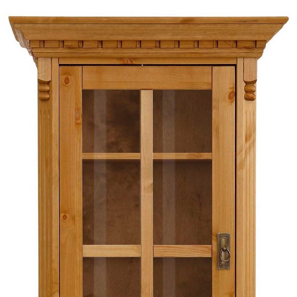 Oberer Bereich der Massivholz Vitrine mit verglaster Tür, sichtbarem Regal und dekorativer Kranzleiste – Fausanda