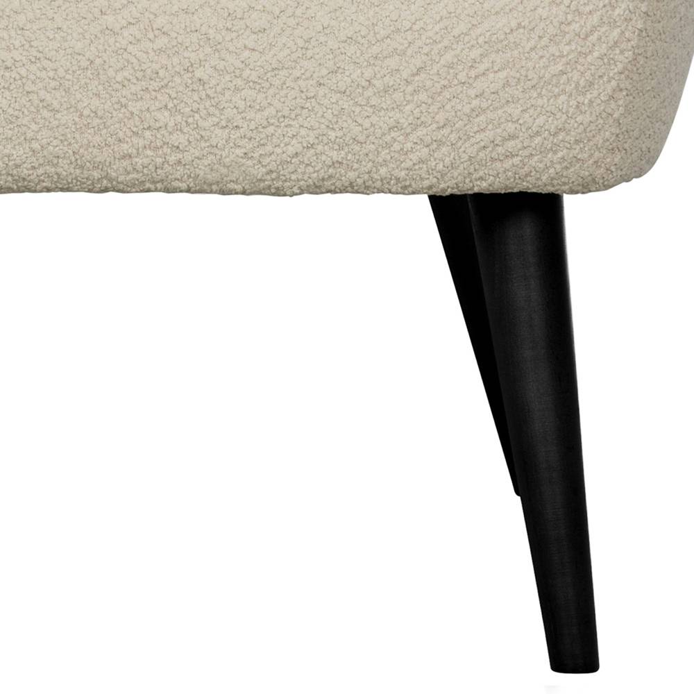 Schwarze, konische Holzbeine einer eleganten Wohnzimmercouch mit Boucle-Bezug – Luvrenossa