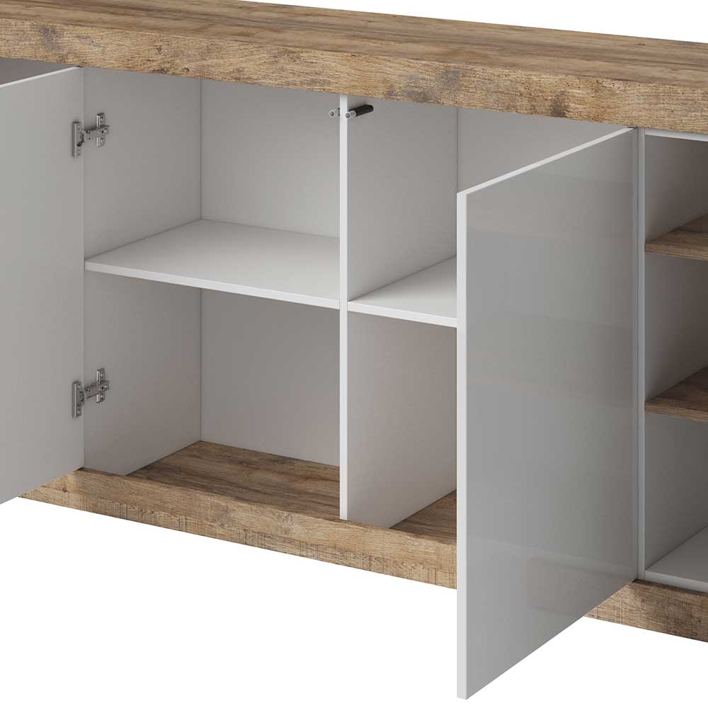Geräumige Schrankfächer mit variablen Einlegeböden hinter Hochglanz Türen am Sideboard – Milvara