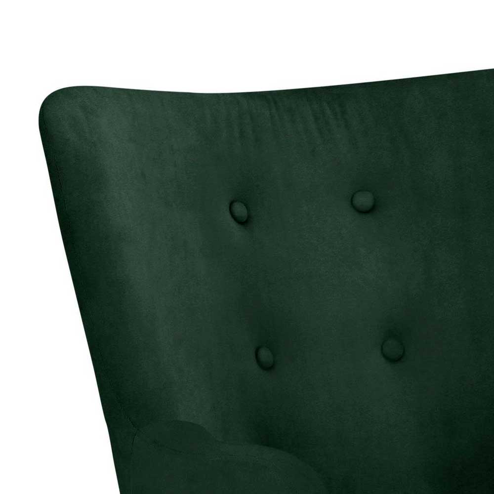 Nahaufnahme der Knopfheftung auf der eleganten R ckenlehne des dunkelgr nen Samtsessels – Coraoda