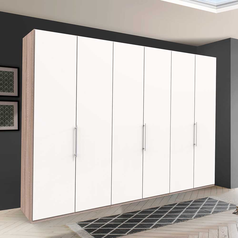 Großer Kleiderschrank mit sechs weißen Gleittüren und Eiche sägerau Korpus im Schlafzimmer – Vaclyn