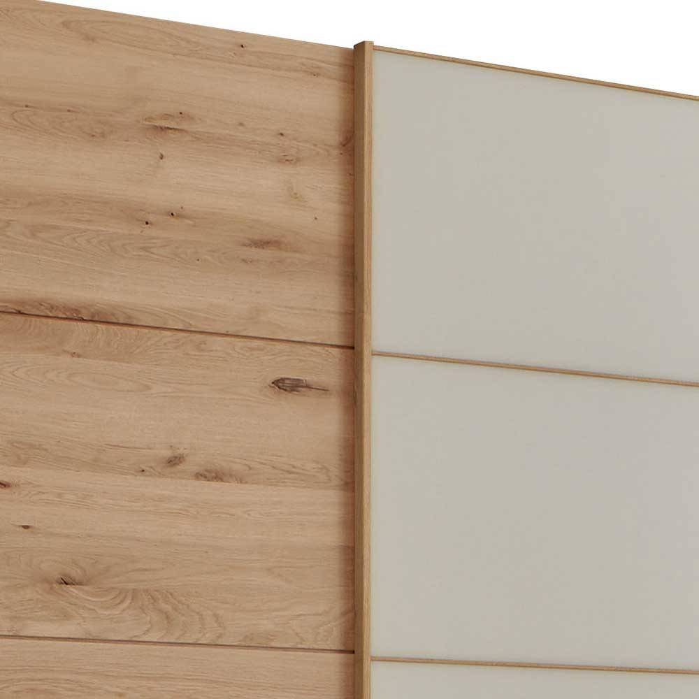 Detailansicht des Kleiderschranks mit natürlicher Holzmaserung und beiger Glas-Schiebetür – Nikoba