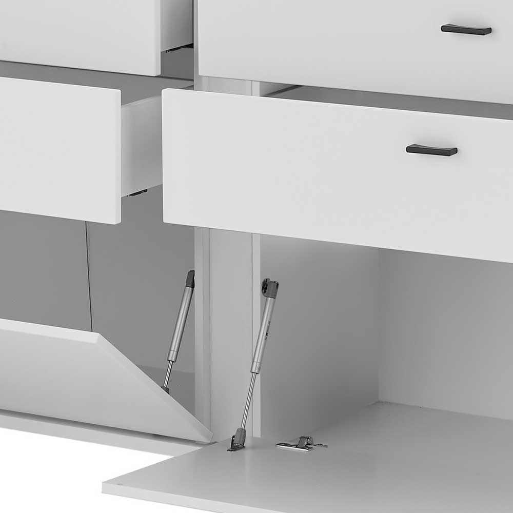 Offene Schublade und Klappe des weißen Sideboards mit Dämpfern – Tirol