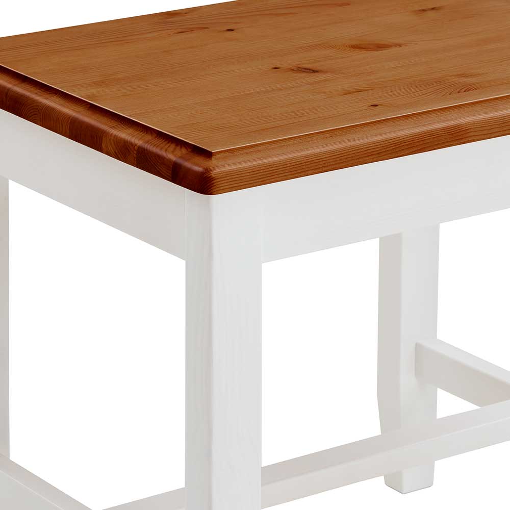 Abgerundete bernsteinfarbene Massivholzplatte des Hockers im Landhausstil mit weißem Gestell – Garella