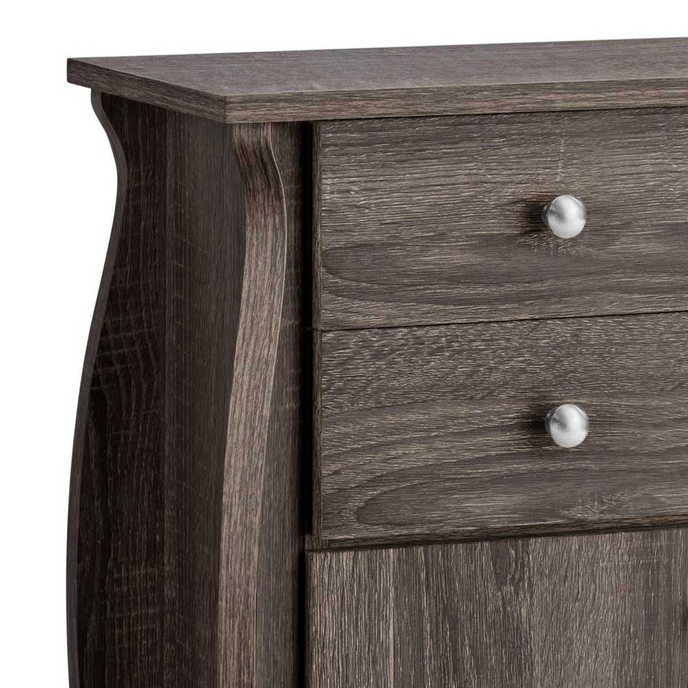 Seitliche Ansicht des Holzoptik Schranks, obere Schublade und geschwungene Kante – Fionora