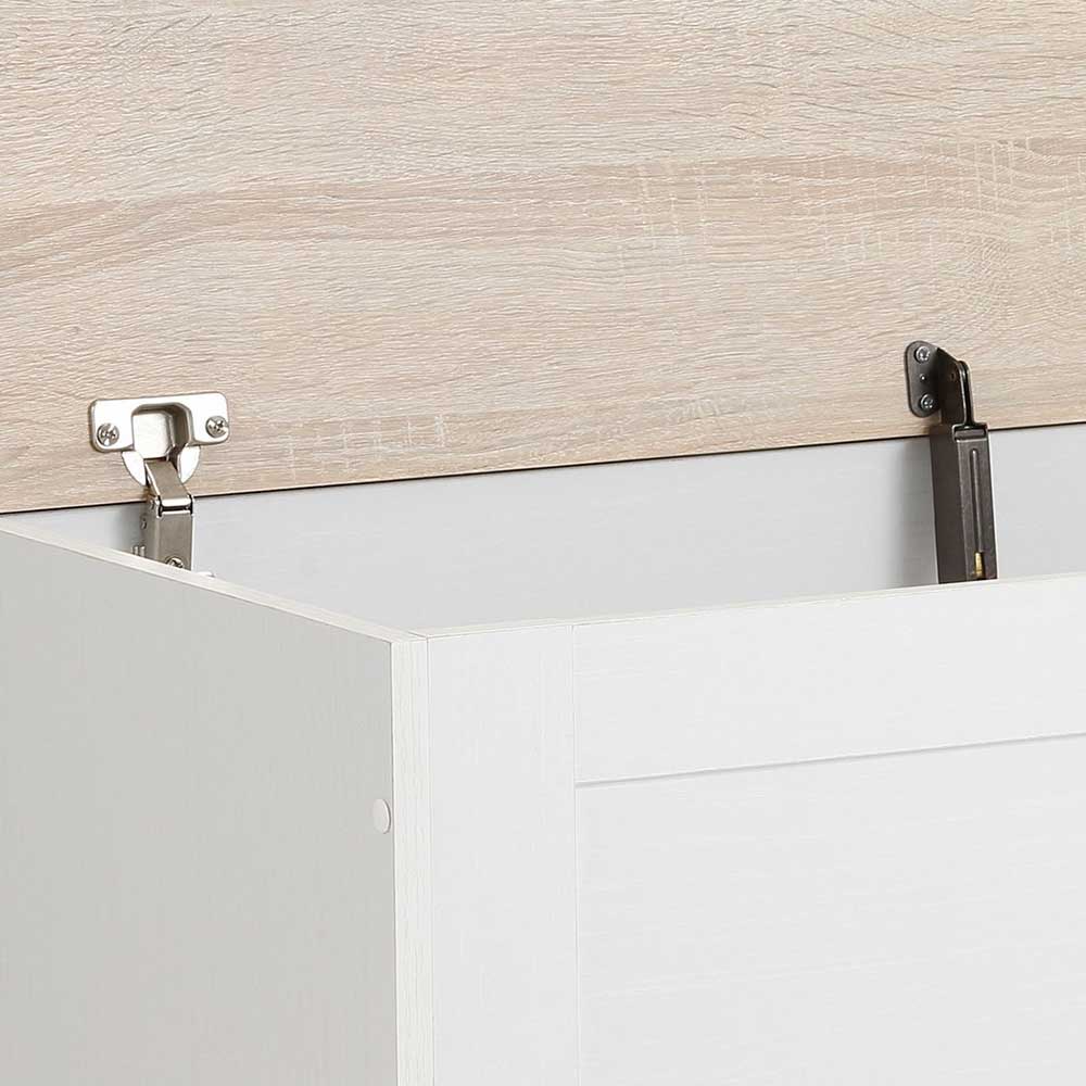 Robuste Metallscharniere am geöffneten Eichenholzdeckel der weißen Truhe – Ridron