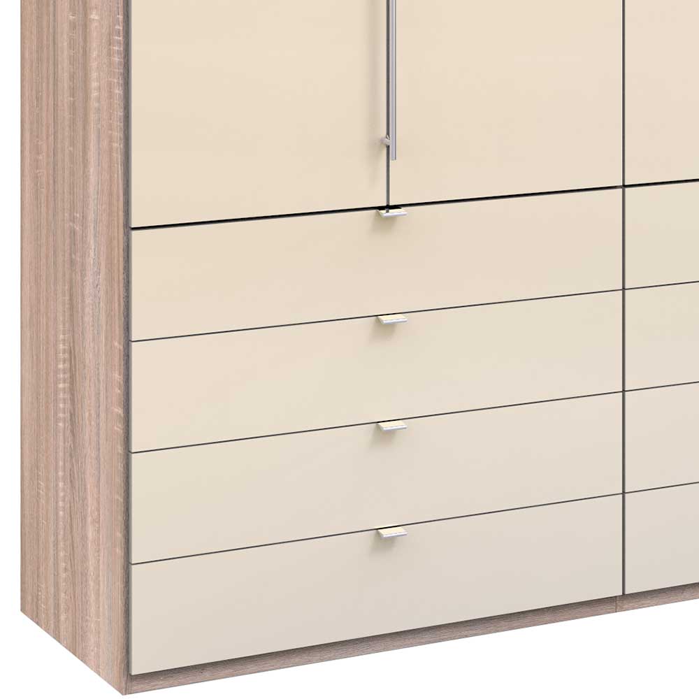 Cremefarbene Kleiderschrank-Schubladen im Detail mit Holzoptik-Seiten und silbernen Bügelgriffen – Rativian