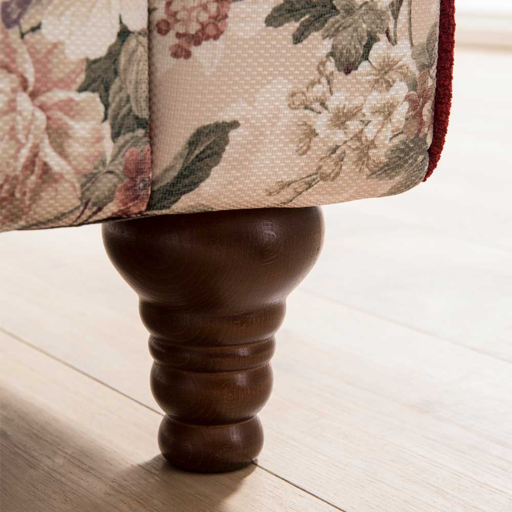 Polsterhocker mit gedrechseltem Holzfuß und Vintage Blumen Muster für das Wohnzimmer – Baonga