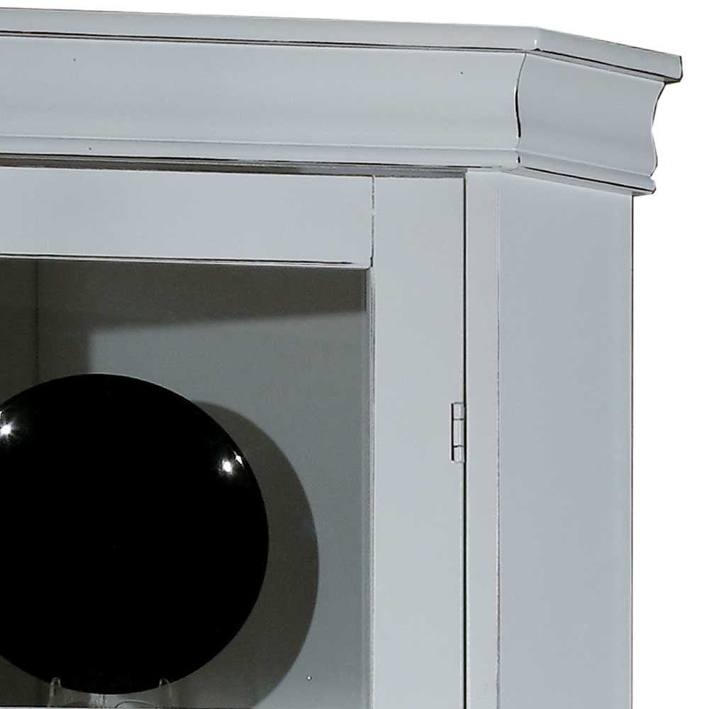 Oberer Bereich der Eckvitrine mit eleganter Kranzleiste und Glastür im Vintage Design – Zarinas
