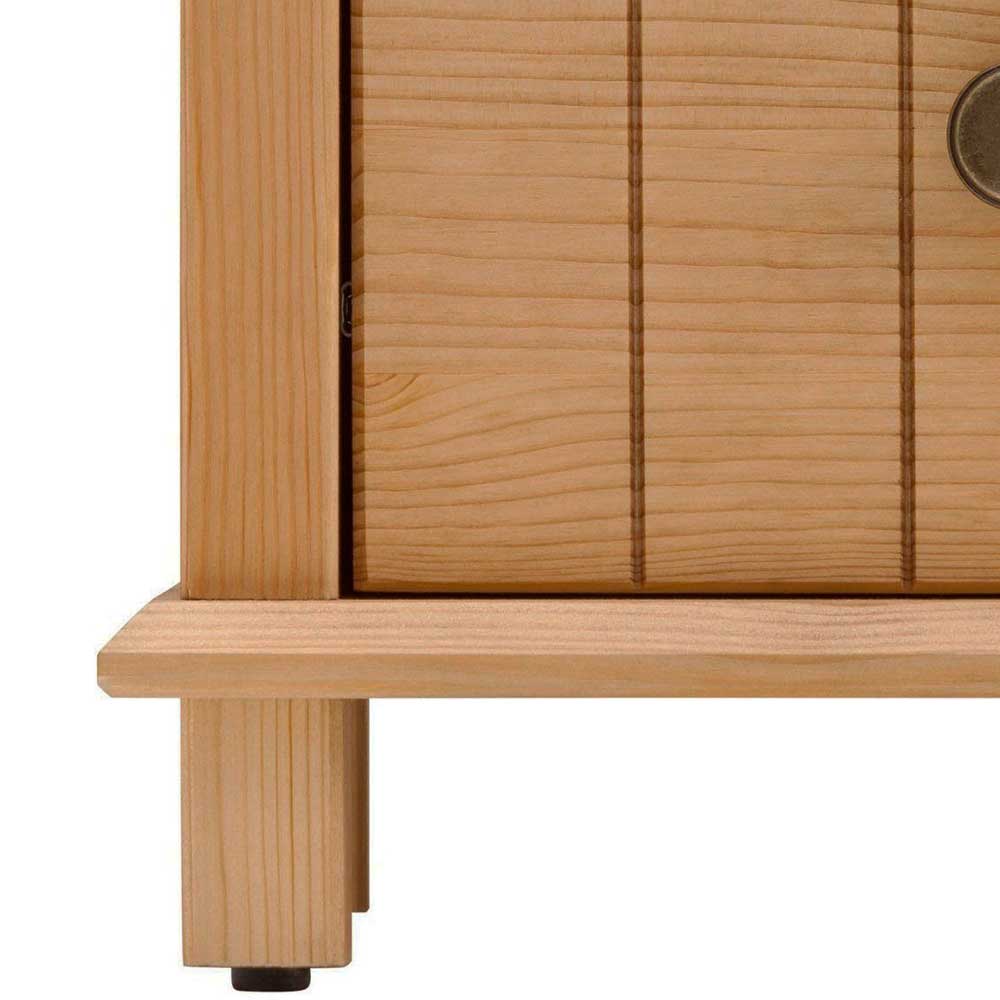 Unterer Bereich der Naturholz Kommode mit kleinen Standfüßen und Holzmaserung – Akzinad