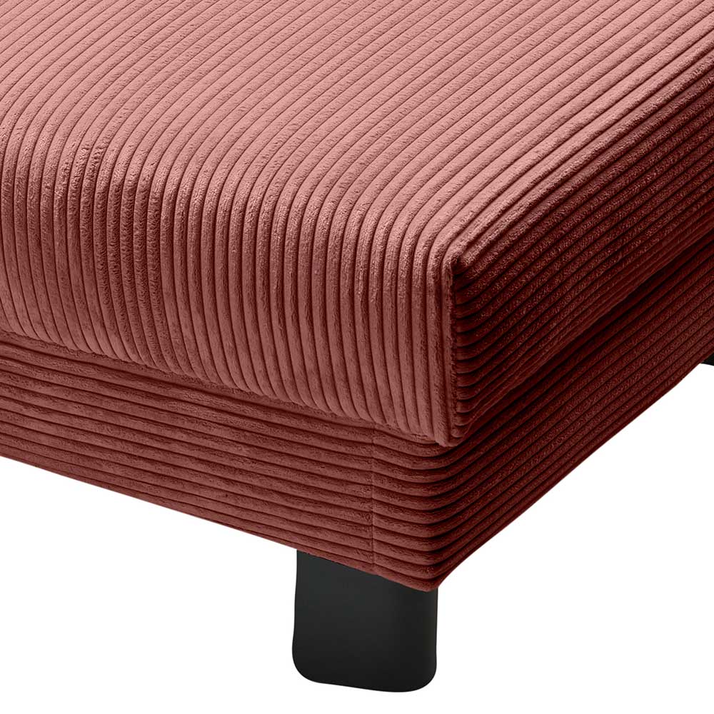 Eckdetail des roten Cord Schlafsessels mit robustem schwarzen Standfuß – Isakin