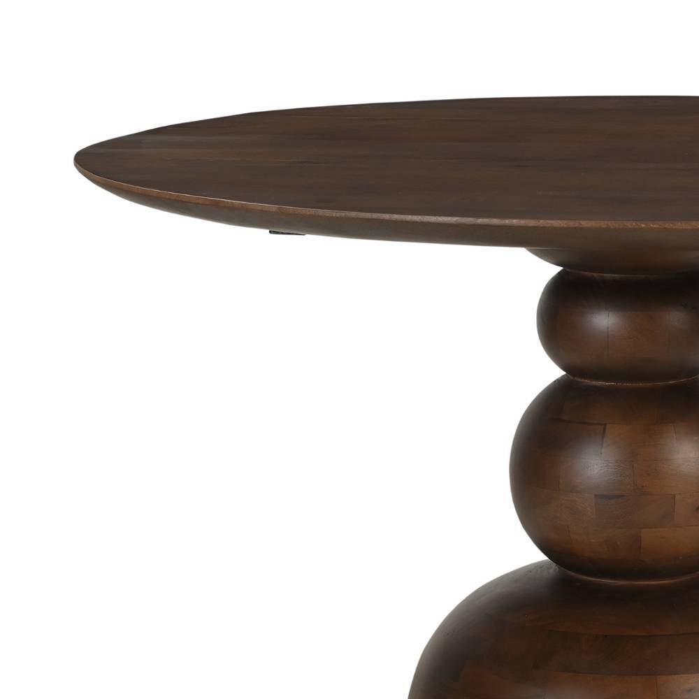 Elegante Tischplatte des runden Esszimmertisches aus dunklem Massivholz und oberer Säulenfußbereich – Tanky