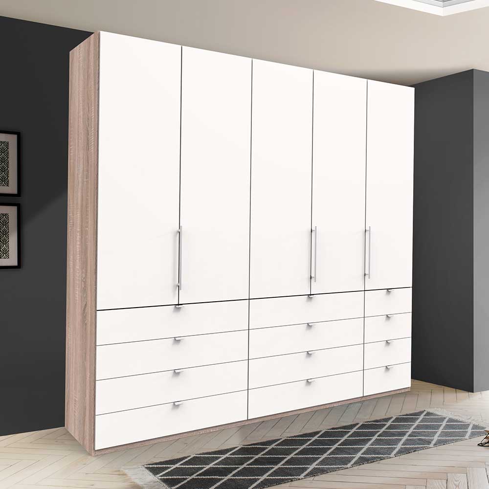 Großer Kleiderschrank in Weiß mit Holzoptik-Seiten, vielen Schubladen und Drehtüren für Schlafzimmer – Vaclyn