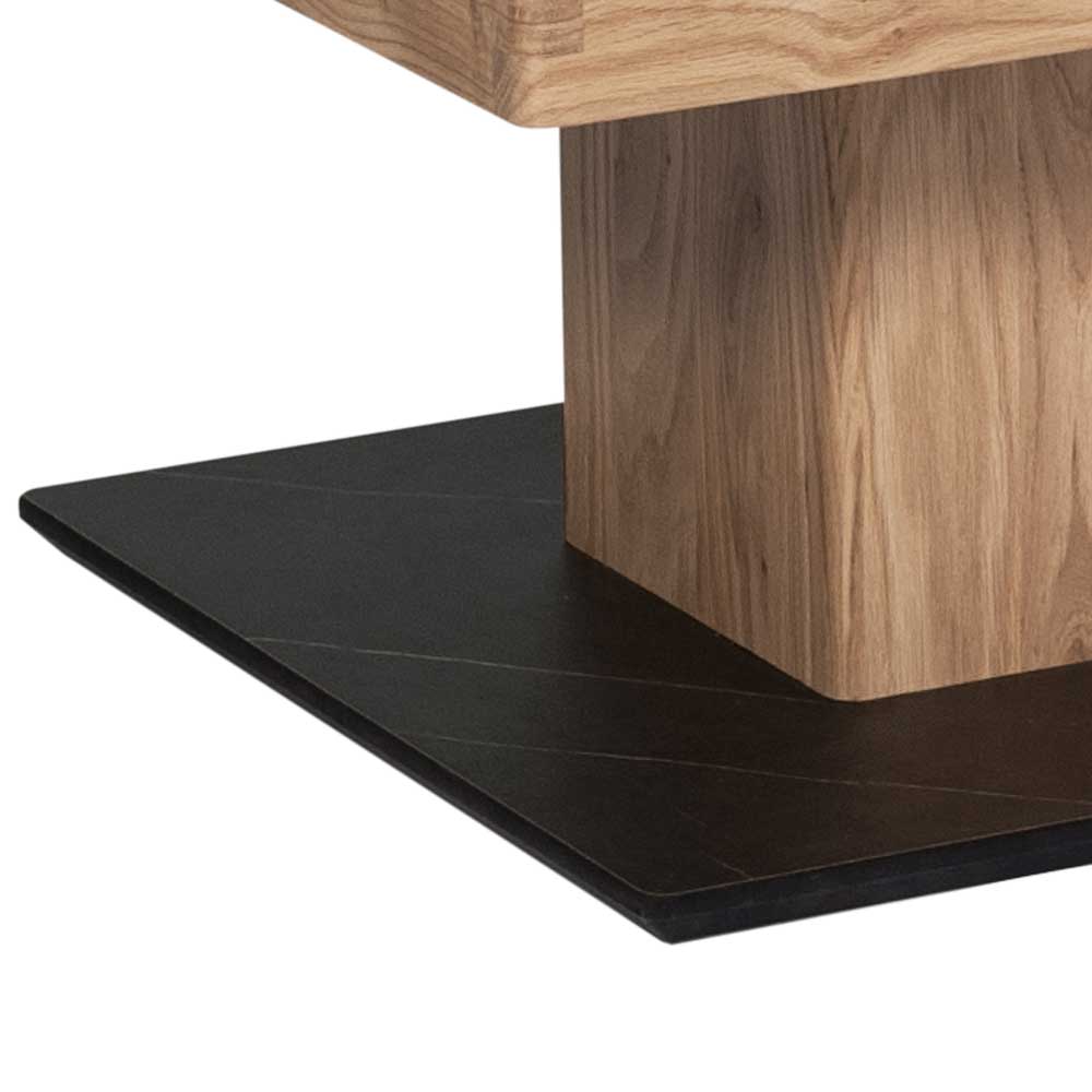 Schwarzer Standsockel mit feiner Musterung und Holzsäulenfuß des modernen Couchtisches – Fymo