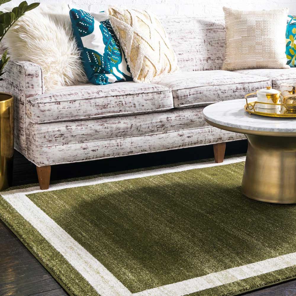 Teppich in Oliv Grün mit Rahmen in Creme - Loritana