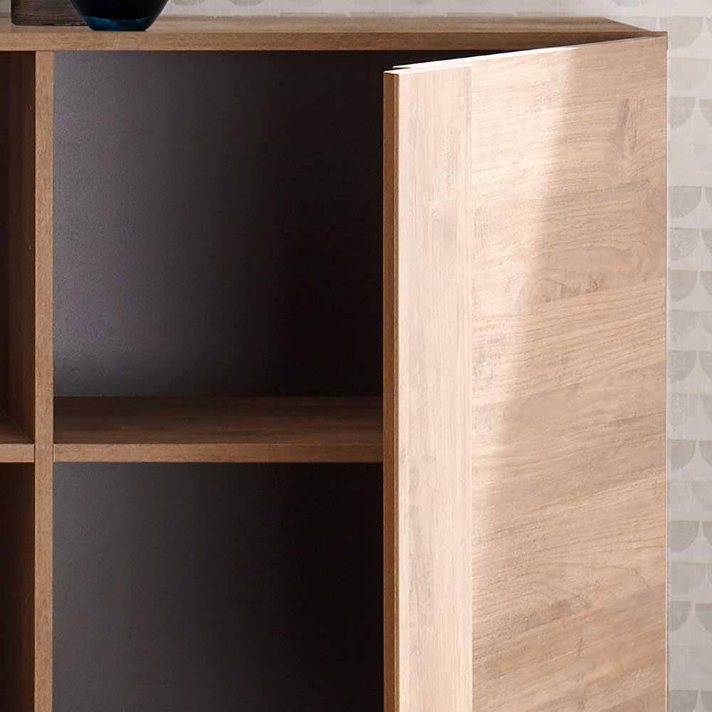 Kommode in Holzoptik mit halboffener Tür und Blick auf das geräumige Innenfach – Basento