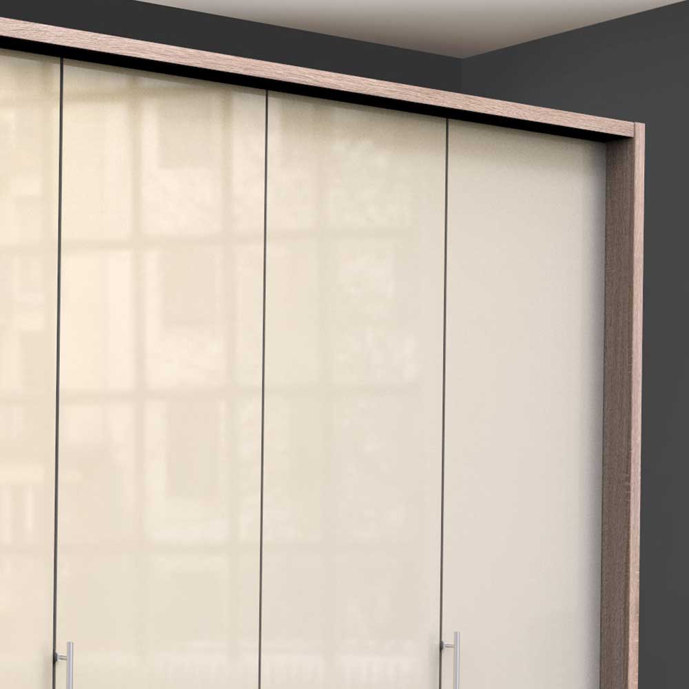 Oberer Bereich des Falttürenschranks mit heller Holzoptik und glasbeschichteter cremefarbener Front, spiegelnd – Rativian