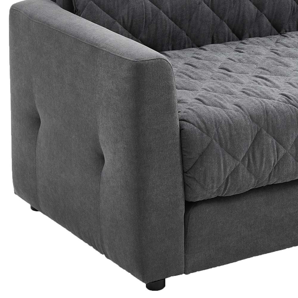 Rechte Armlehne mit Knopfheftung und gestepptem Bezug des grauen Schlafsofas – Riconia