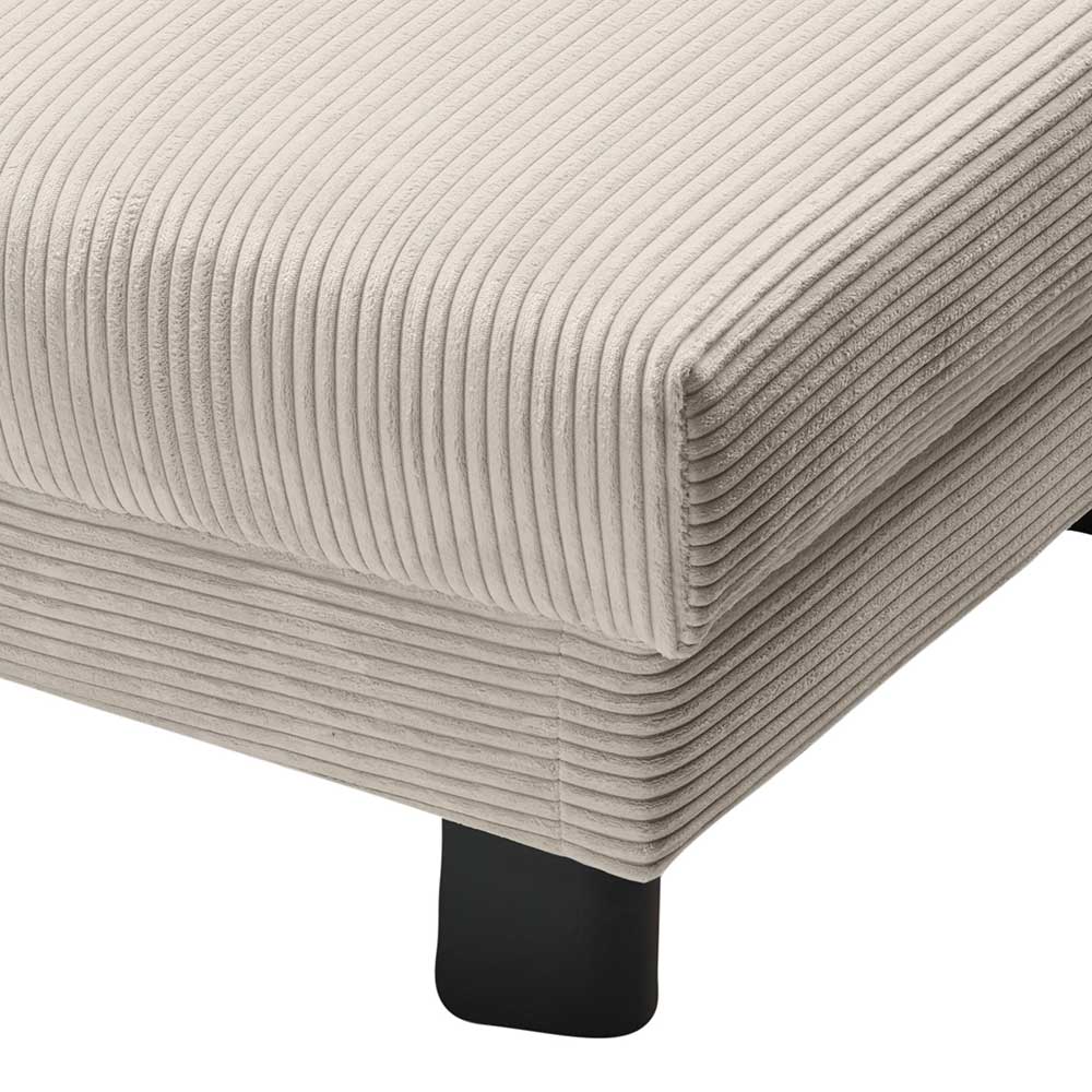 Eckdetail des beigen Cord Schlafsofas mit robusten schwarzen Möbelfüßen – Samurai