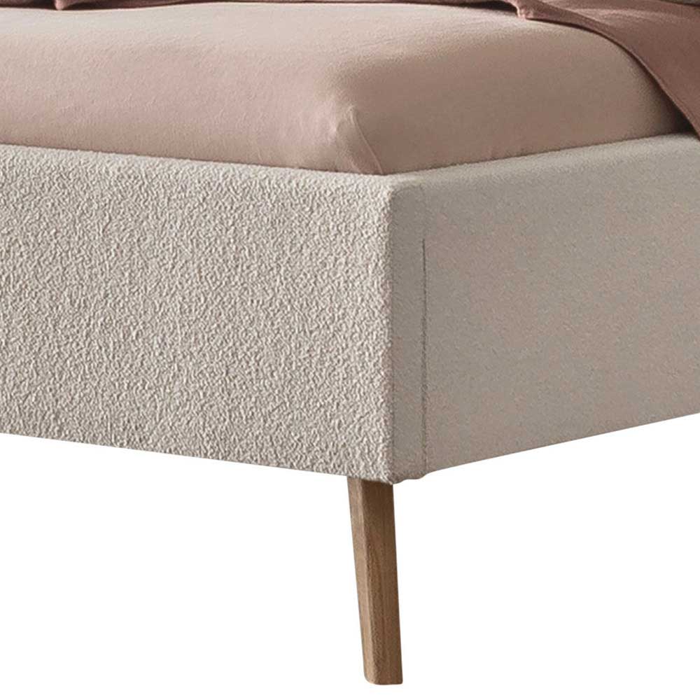 Fußteil des 140x200 Bettes mit cremefarbenem Boucle Bezug und Massivholzfüßen – Leya
