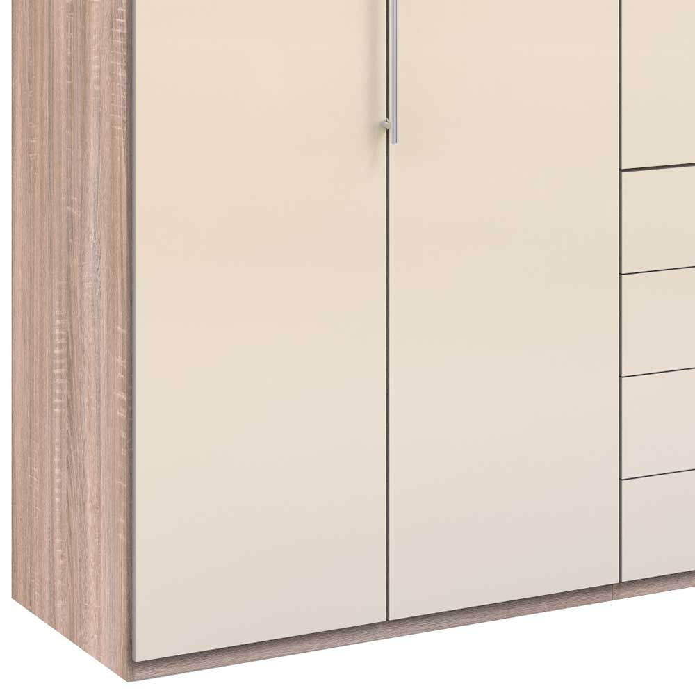 Detailansicht des Kleiderschranks mit Seitenwand in heller Holzoptik und cremefarbener Hochglanzfront – Rativian