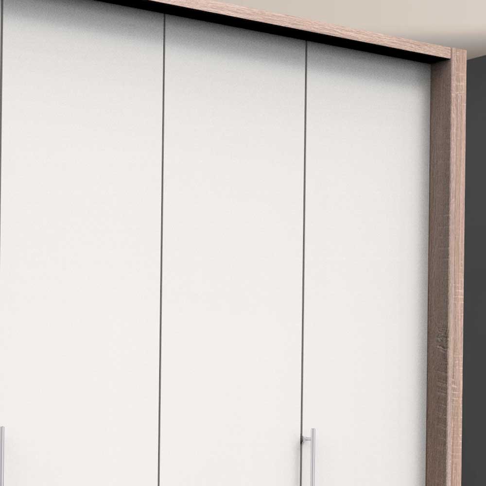 Obere Ecke des Falttürenschranks mit naturfarbener Holzoptik und weißer Frontansicht der Türen – Vaclyn