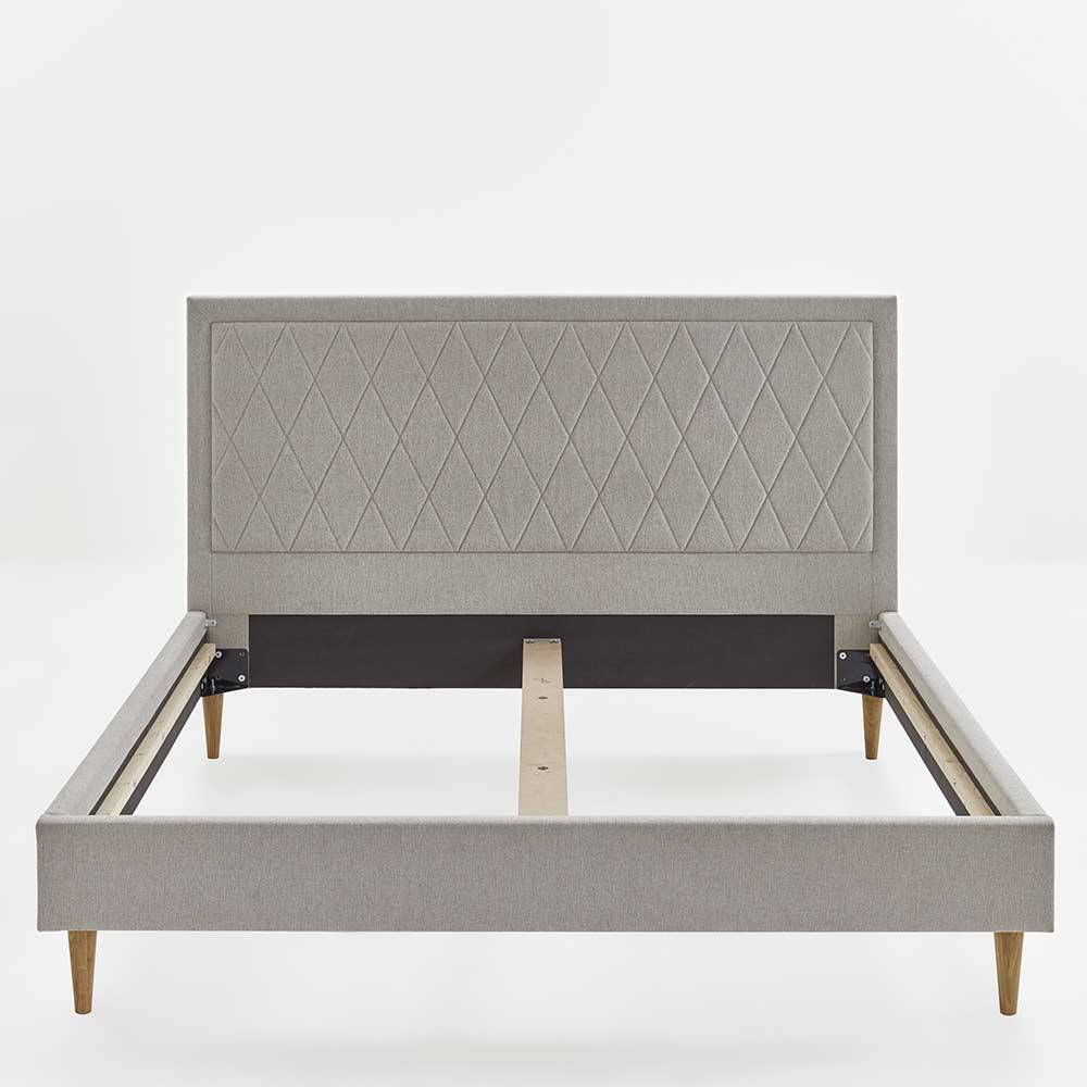 Stoff Doppelbett in Creme mit Holzbeinen - Linvares