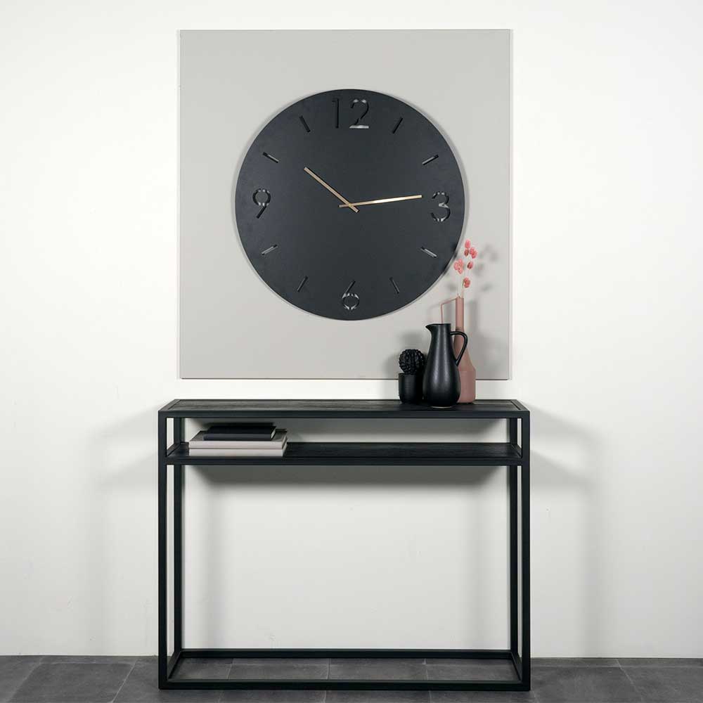 Elegante schwarze Wanduhr über einer Konsole im modernen Flurambiente – Santorina