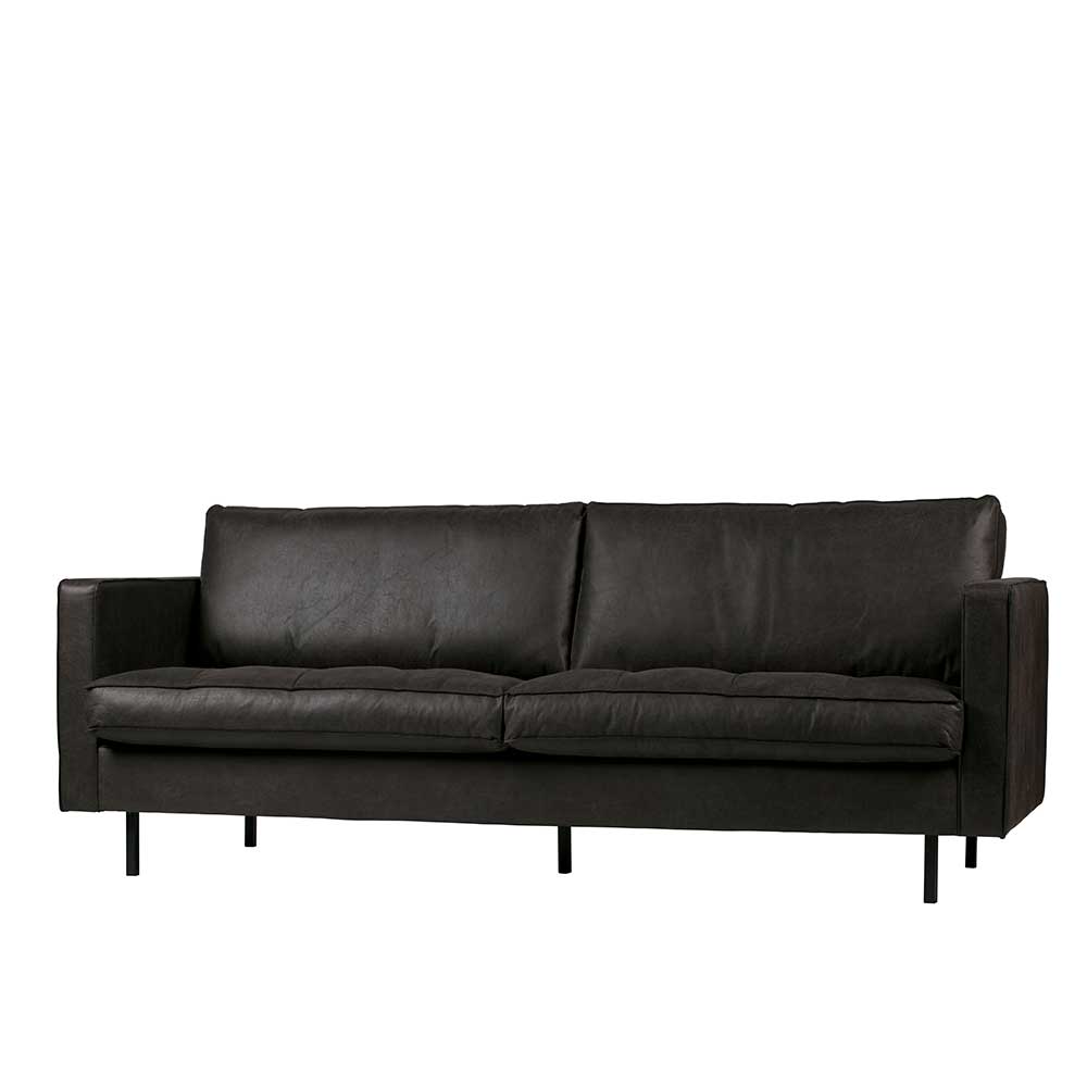 Schwarzes 3-Sitzer Ledersofa für das Wohnzimmer in leicht schräger Ansicht mit fester Polsterung – Avonita