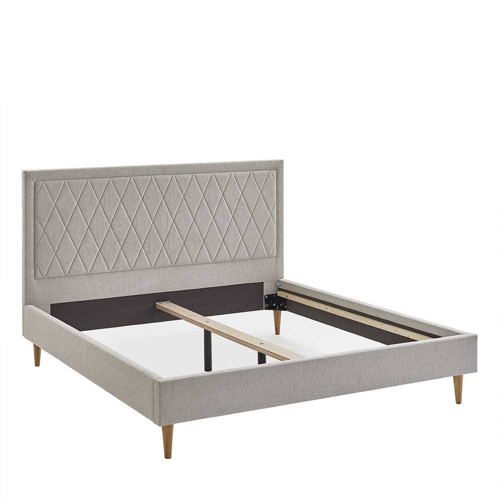 Stoff Doppelbett in Creme mit Holzbeinen - Linvares