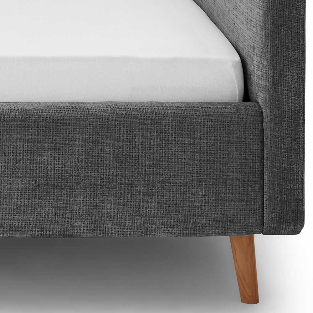 Textur des anthrazitfarbenen Boucle-Bettrahmens mit konischem Holzfuß – Riety