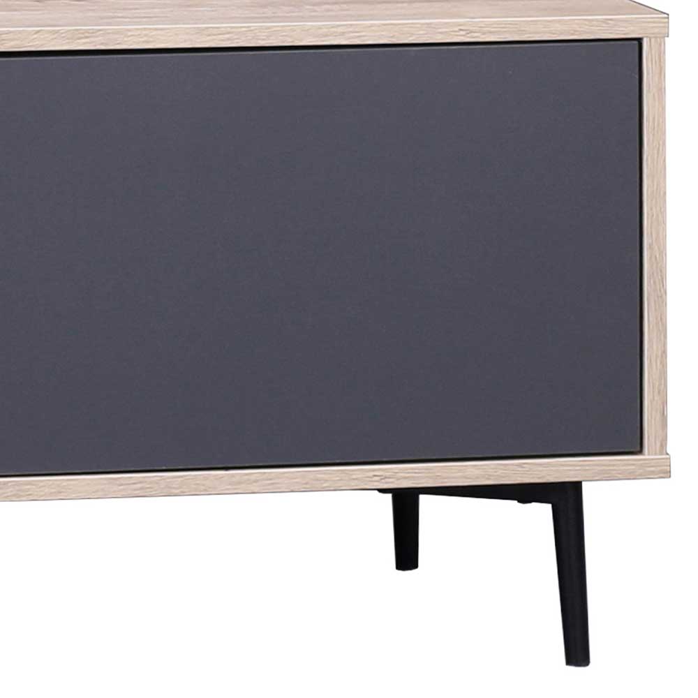 Frontansicht der geschlossenen dunklen Tür des TV Boards und der schwarzen Füße – Travolda